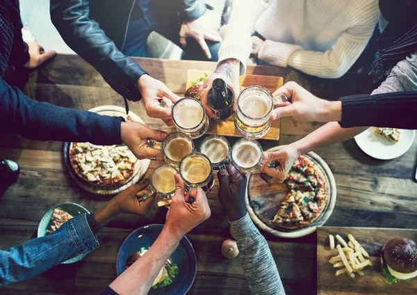 depositphotos_199404082-stock-photo-friends-toasting-craft-beer